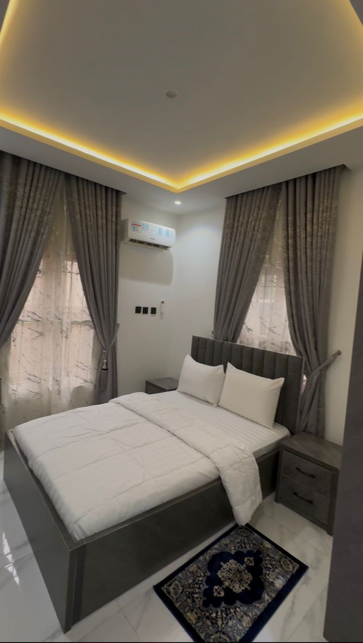 Elegant bedroom interior with warm ceiling lighting